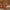 Orange Tiki torch with flame, set on wooden surface.