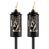 Black Tiki torches with deer and tree designs, flame lit.