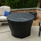 Black outdoor patio table cover on round table, beside white lounge chair and planter.