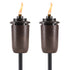 Bronze Tiki torches with flame, outdoor lighting.