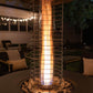 Gold spiral patio heater with glowing flame, outdoor setting.