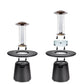 Black outdoor patio heater with glass cage and circular base.