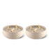 Beige Tiki triple-wick candles in textured ceramic holders.