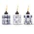 White ceramic Tiki torches with blue geometric patterns, lit flames.