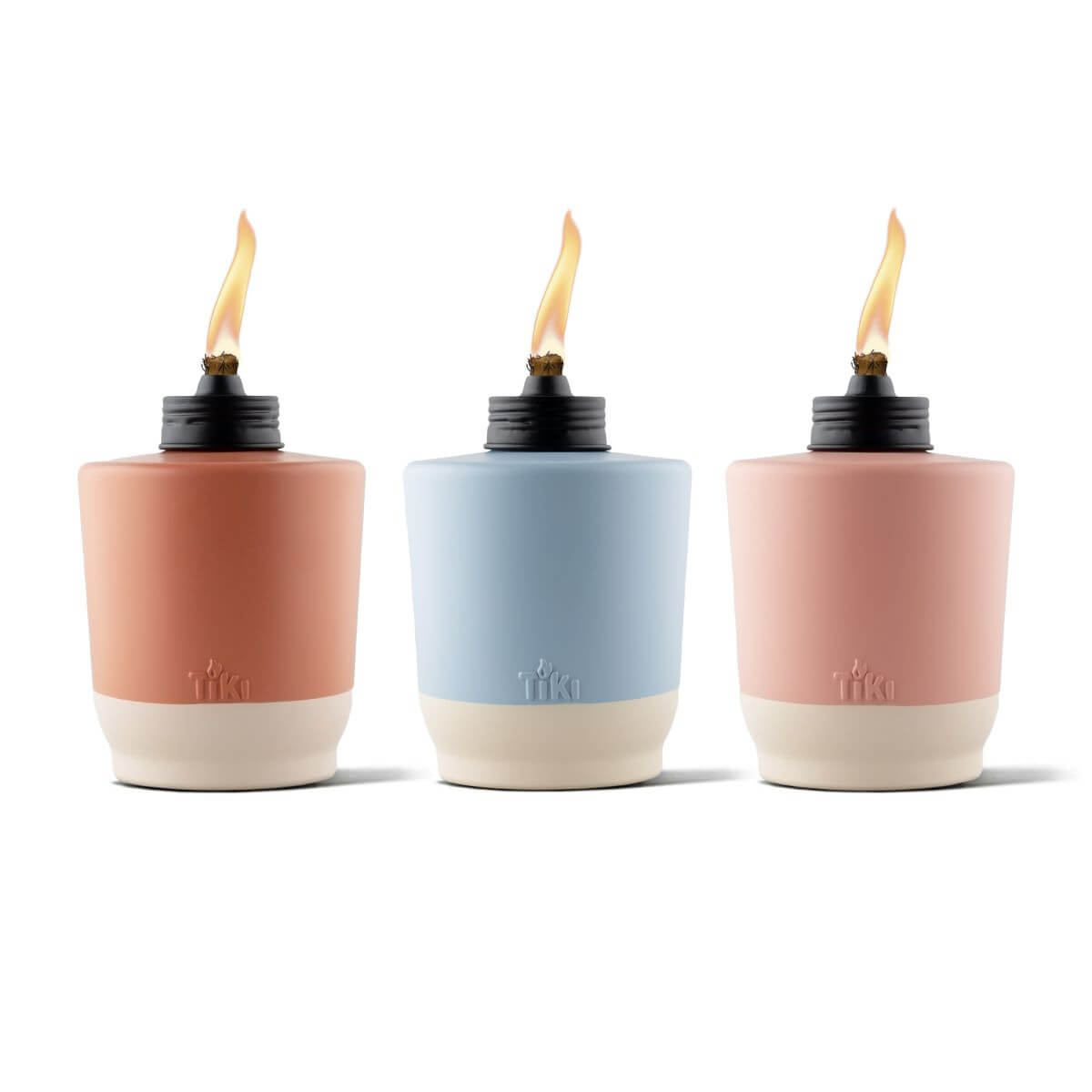 Three Tiki torches in coral, blue, and blush pink with cream bases and black tops.