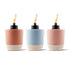 Three Tiki torches in coral, blue, and blush pink with cream bases and black tops.