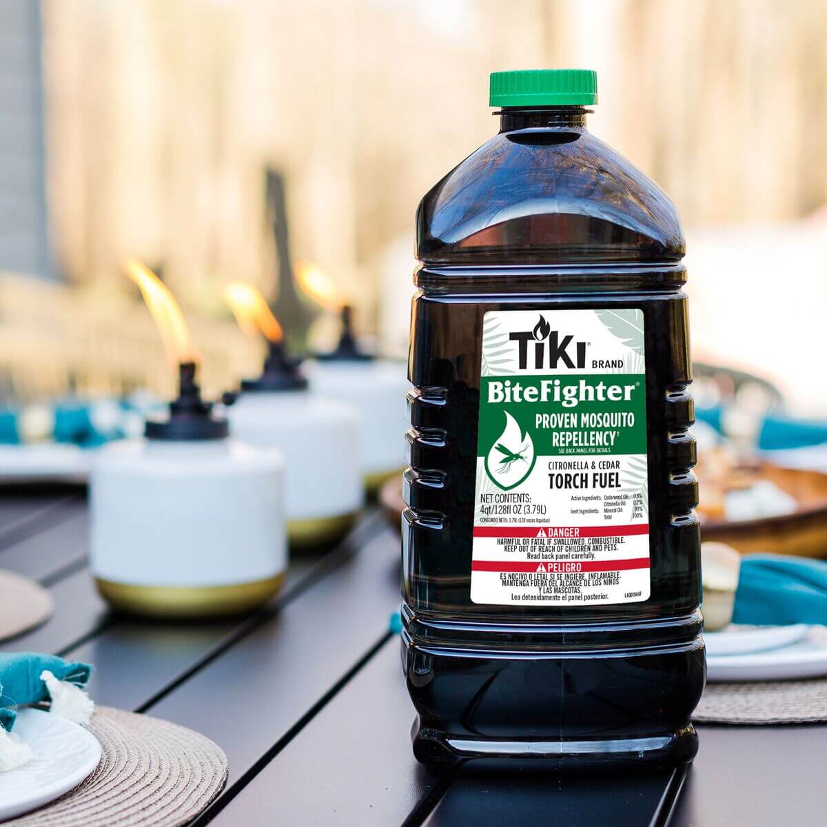 Black TIKI BiteFighter Citronella & Cedar Torch Fuel bottle with green cap.