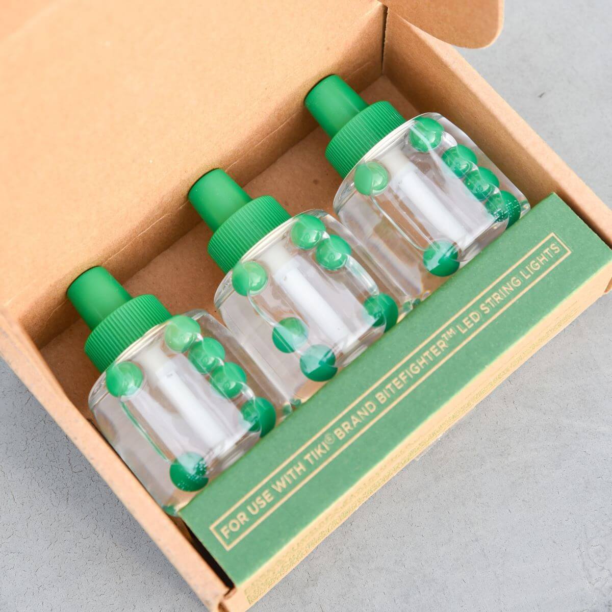 Green TIKI Brand BiteFighter LED String Lights in a cardboard box.