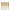 Set of four bamboo torches with black tops and lit flames.