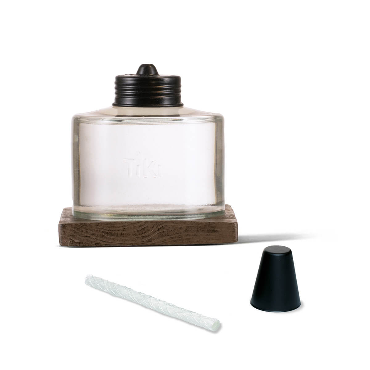 Clear glass Tiki candle holder with wooden base and black lid.