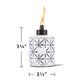 White ceramic oil lamp with blue geometric pattern, 5 3/4" tall, 3 1/2" diameter.
