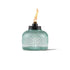 Green glass oil lamp with flame, Tiki brand.
