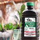Black Tiki Brand BiteFighter mosquito repellent fuel bottle with green cap.