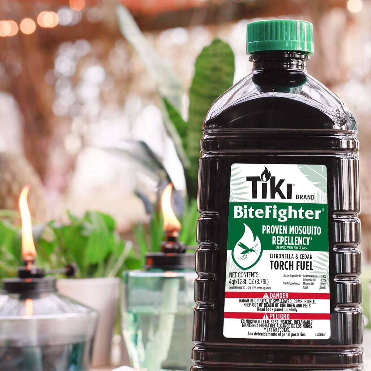 Black Tiki Brand BiteFighter mosquito repellent fuel bottle with green cap.