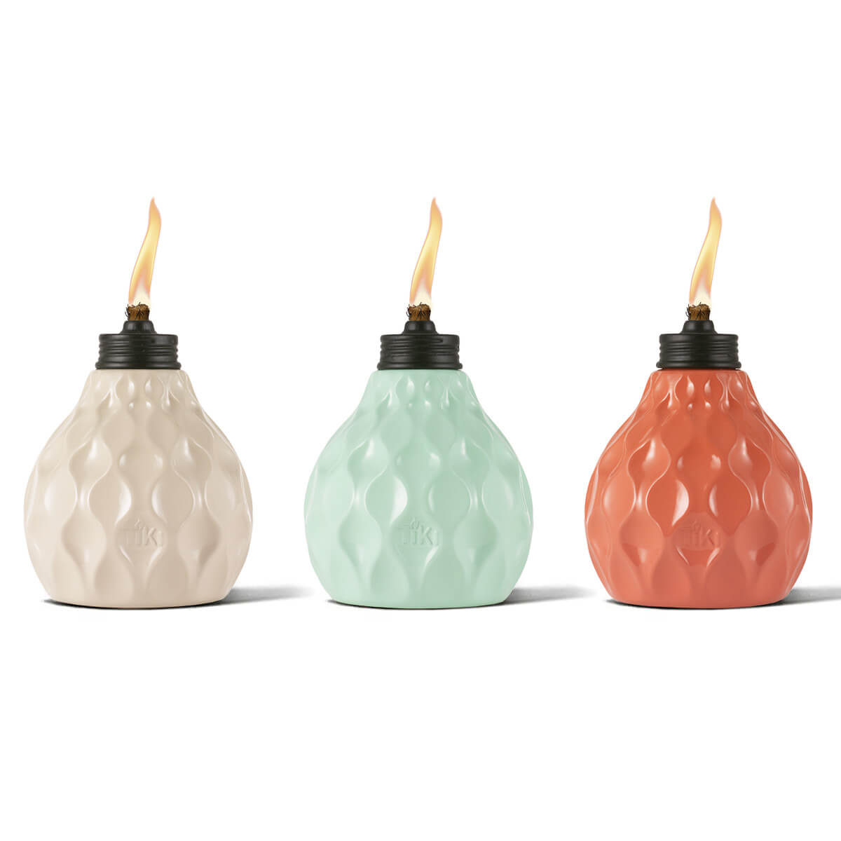 Three colorful ceramic tiki torches in cream, mint, and coral with flame.