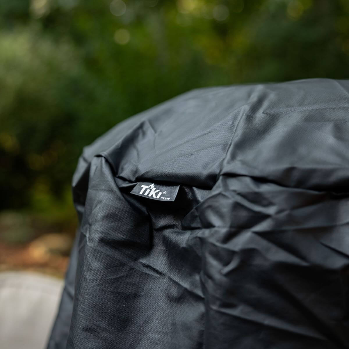 Black TIKI brand backpack with textured fabric.