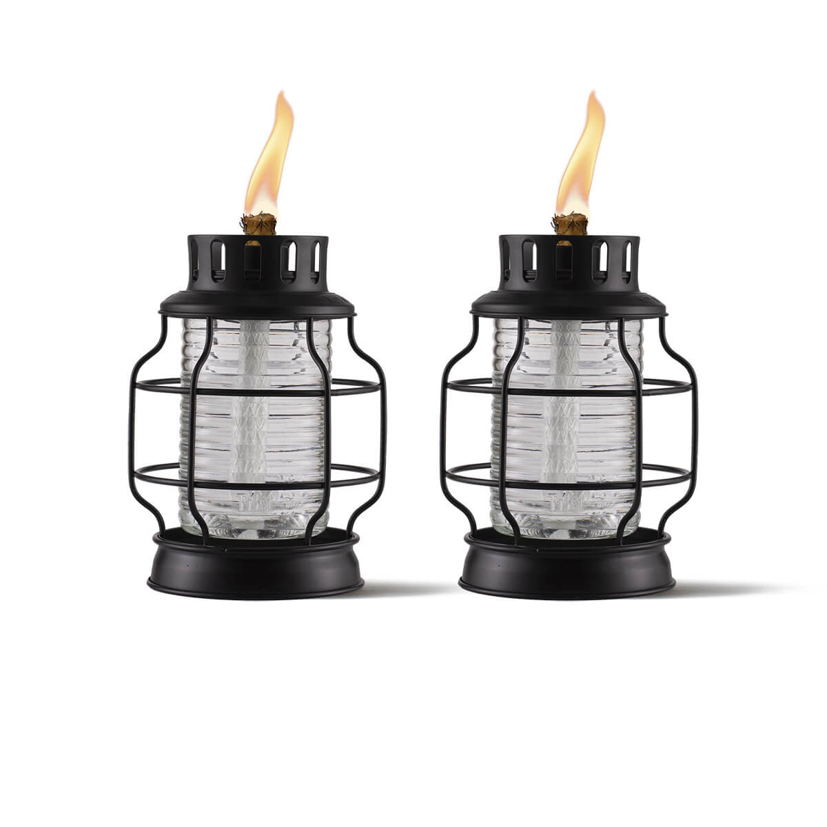 Black glass lanterns with flame, outdoor lighting.