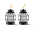 Black glass lanterns with flame, outdoor lighting.
